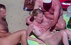 Beautiful bitch groped by his husband and strangers at beach