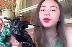 Asian retro smoking with gloves and cigarette holder